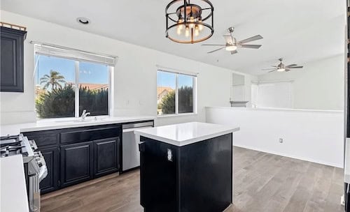 Renovated kitchen with new cabinets and stainless steel appliances