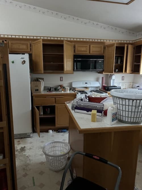 House with peeling floor before repair