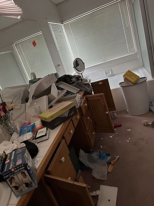 Trashed house interior before cleanup