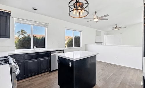 Fully renovated modern kitchen featuring updated cabinetry and quartz countertops in a Southern California home by Ruiz Home Buyers.